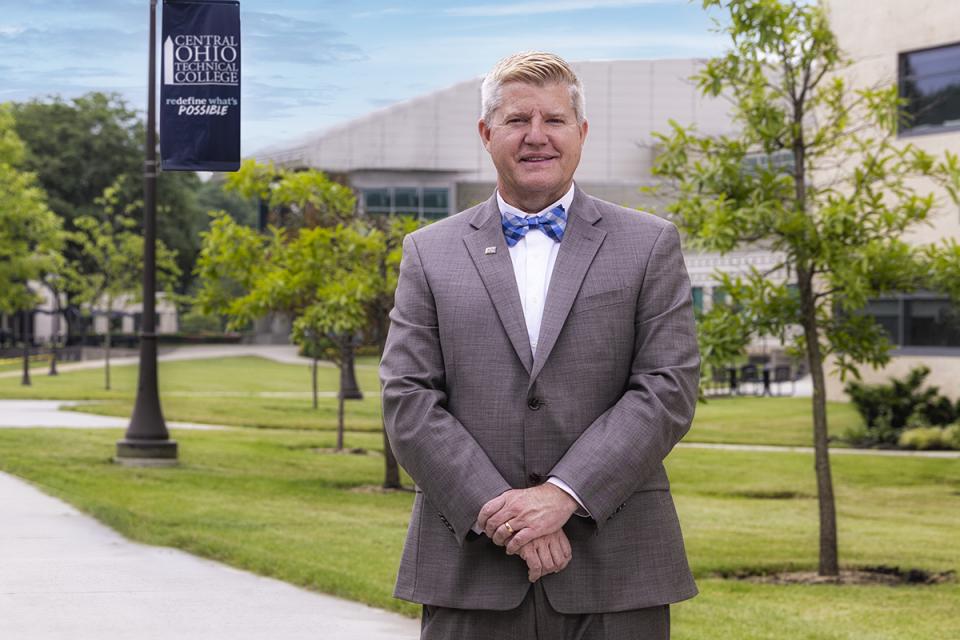 Portrait of COTC President John Berry standing on the Newark campus.