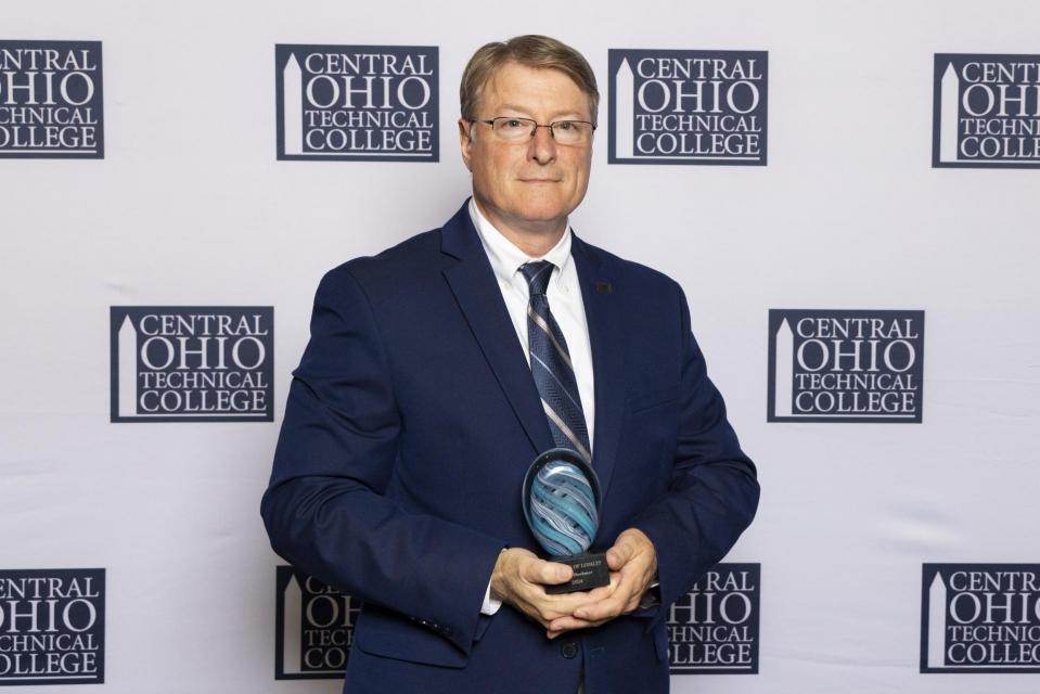 Portrait of Brian Boehmer with his Legend of Loyalty award.