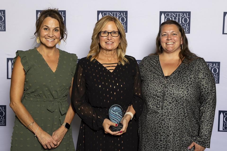 Carrie Lonzo, Jennifer McDonald and Atrina Good representing the Licking County Chamber of Commerce. Portrait of Carrie Lonzo, Jennifer McDonald and Atrina Good representing the Licking County Chamber of Commerce holding their Legends of Loyalty Award.