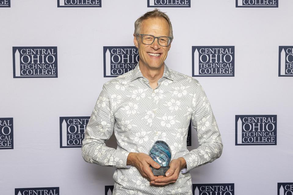 Portrait of William MacDonald with his Legend of Loyalty award.