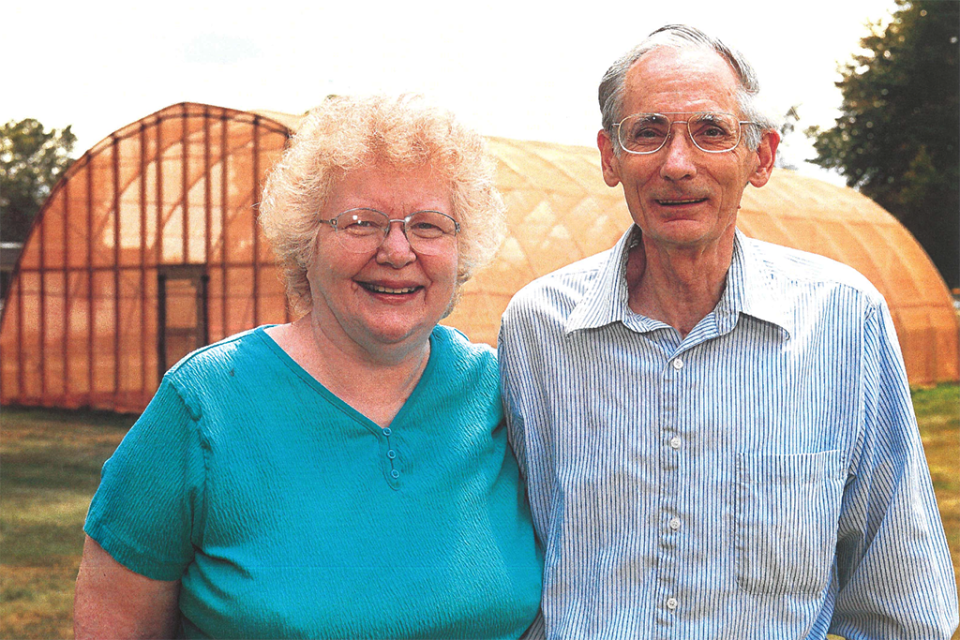 Mary Ellen and Lee St. John Portrait of Mary Ellen and Lee St. John outside of a greenhouse.