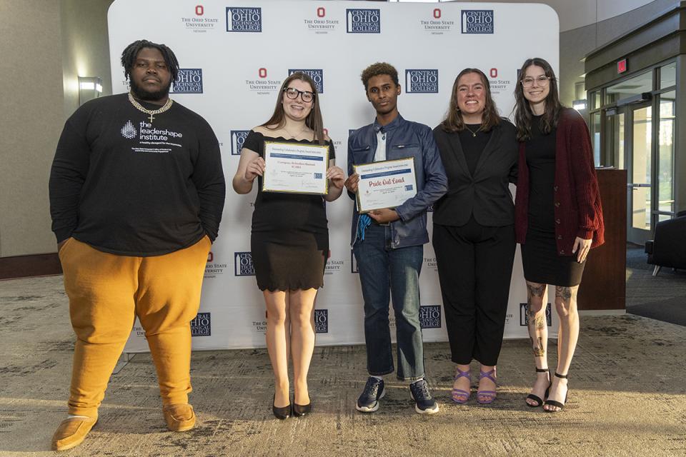 Aaron Sakwa, Allie Nelson, Dannie Tsegaye, Dani Wuichne and Sage Chesser, representing Campus Activities Board (CAB) and Pride Out Loud student organizations, Outstanding Collaborative Program Award recipients Portrait of members of Campus Activities Board (CAB) and Pride Out Loud student organizations holding their award certificates.