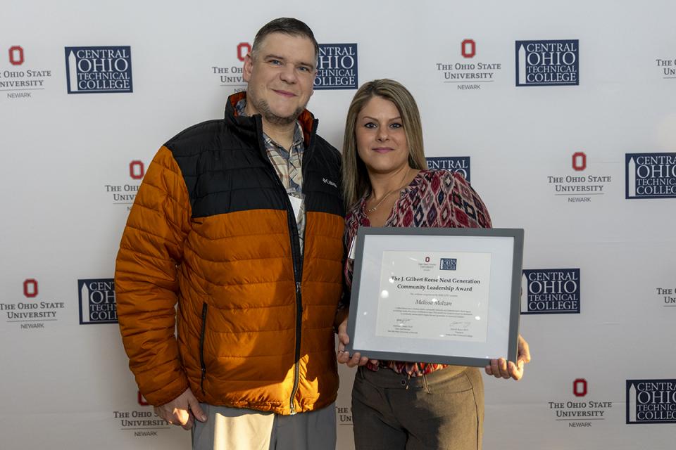 Melissa Molzan, J. Gilbert Reese Next Generation Community Service Leadership Award recipient Portrait of Melissa Molzan holding their award certificate.