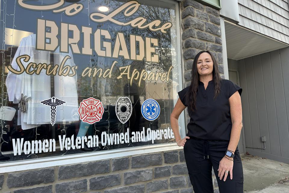 Lacey McCombs stands in front of her storefront in Coshocton.