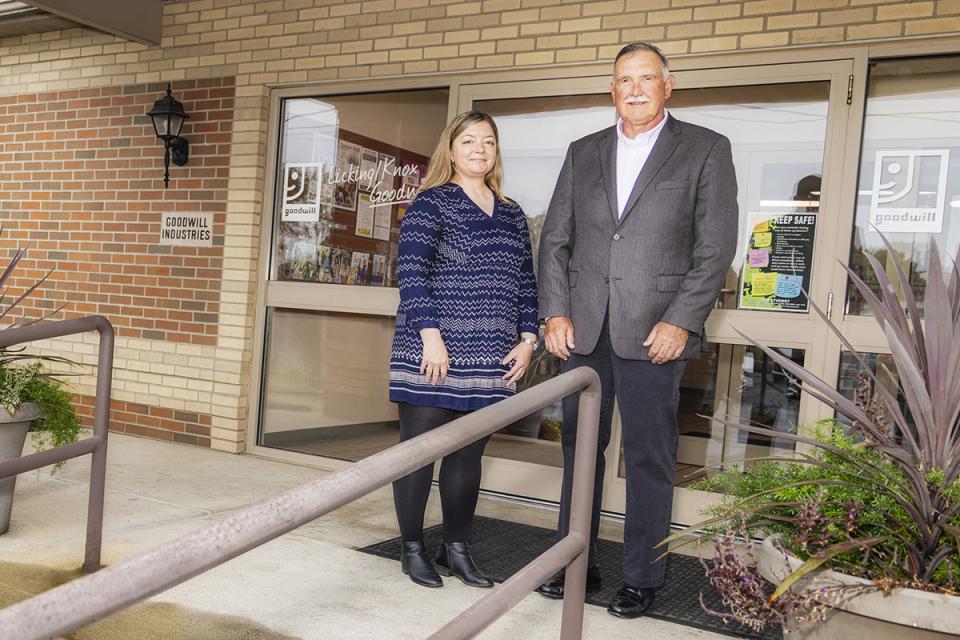 Sonja Darsee and Timothy Young stand in front of the Licking Knox Goodwill building.