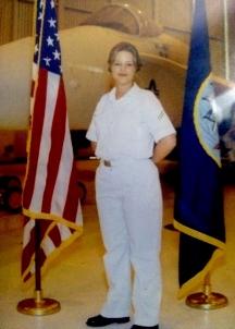 Portrait of Megan Connell-Cox in white navy uniform. 