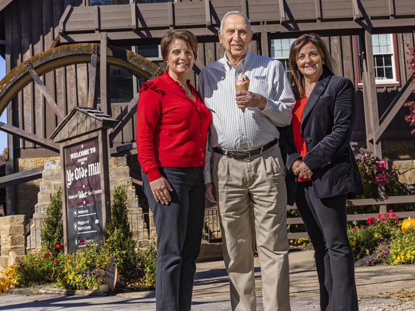 Luconda, Joanne and Joe Dager stand outside Velvet Ice Cream's headquarters in Utica.