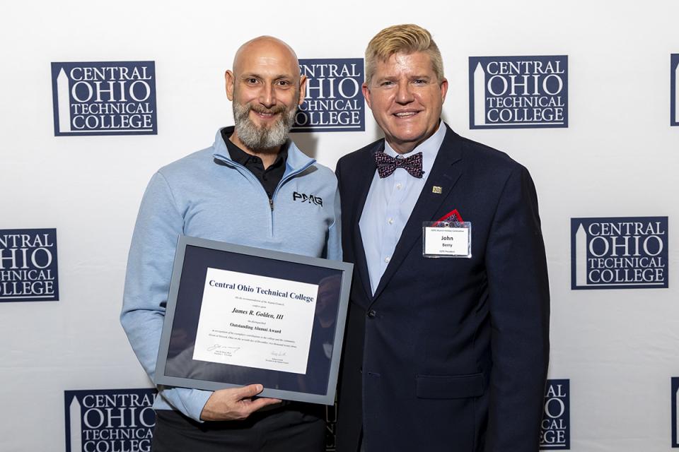 Portrait of James Golden and COTC President John Berry. 