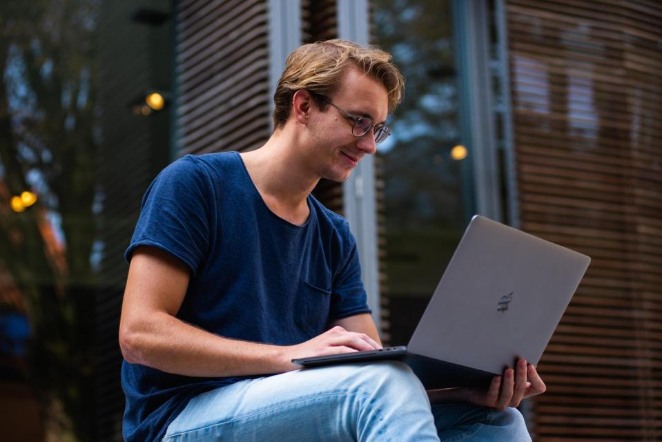 Student Studying at table with laptop