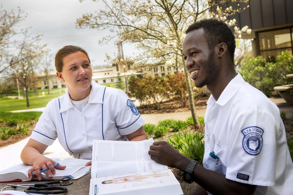 COTC students sitting at a table